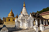 Bagan Myanmar. Shwezigon pagoda. The precinct is full of numerous images, inscribed bells, stone inscriptions and other paraphernalia.  